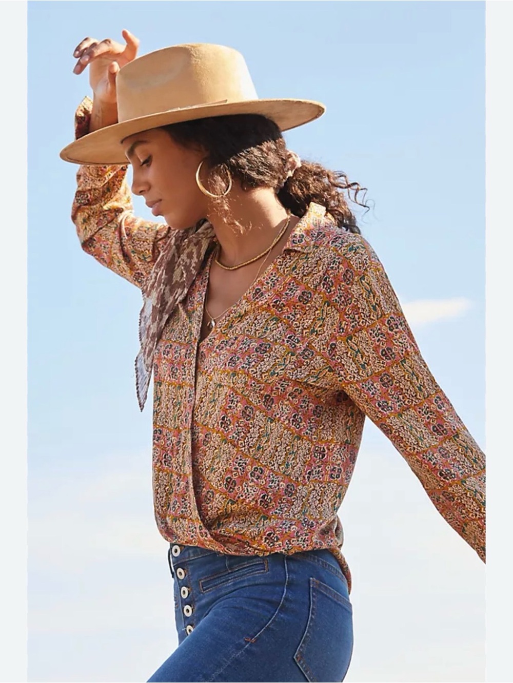Anthropologie Pilcro Tisha surplice blouse featuring a colorful patchwork print